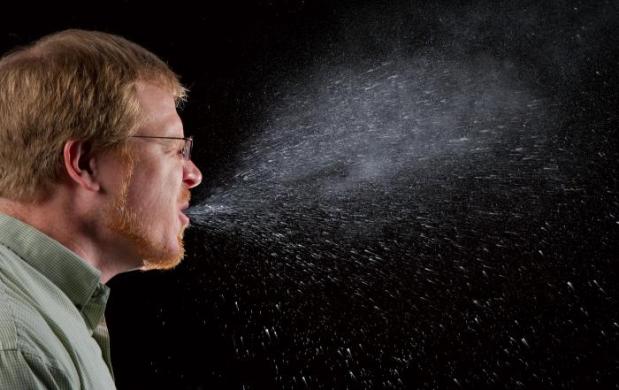 Man Sneezing - Courtesy of CDC public domain